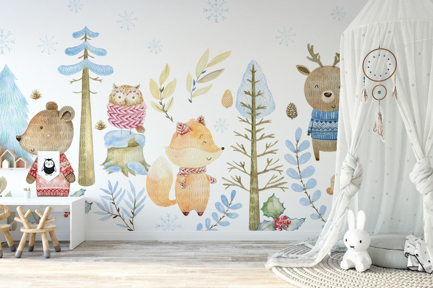 Winter wildlife mural creating a peaceful snowy forest scene in nursery.
