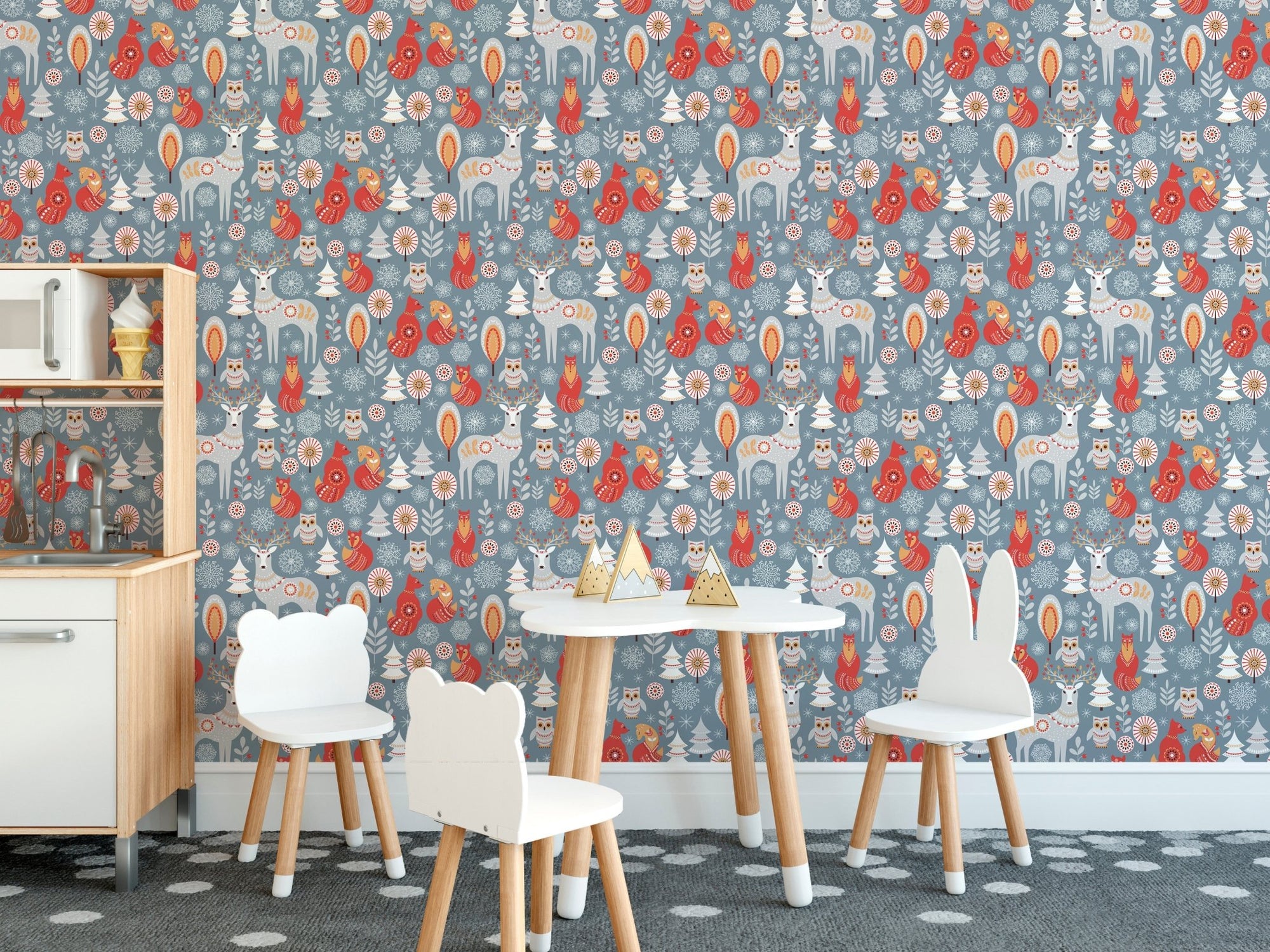 Winter Wonderland with Deer and Fox Wallpaper in a play area with white furniture.
