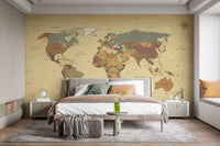 Earth tone world map wall mural in a bedroom with white side tables.