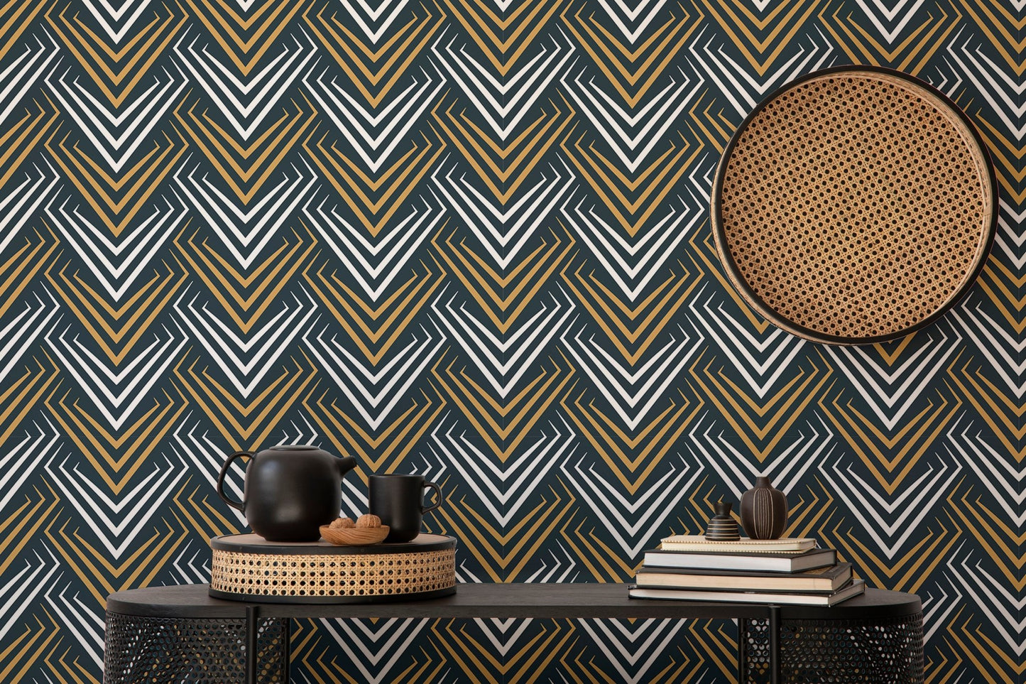 Abstract chevron wallpaper paired with a circular wicker wall hanging and black console.