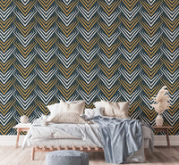 Art deco wallpaper in a bedroom with white bedding and wooden bedside tables.
