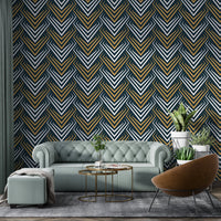 Grey and yellow art deco wallpaper in a living area with a tufted green sofa.