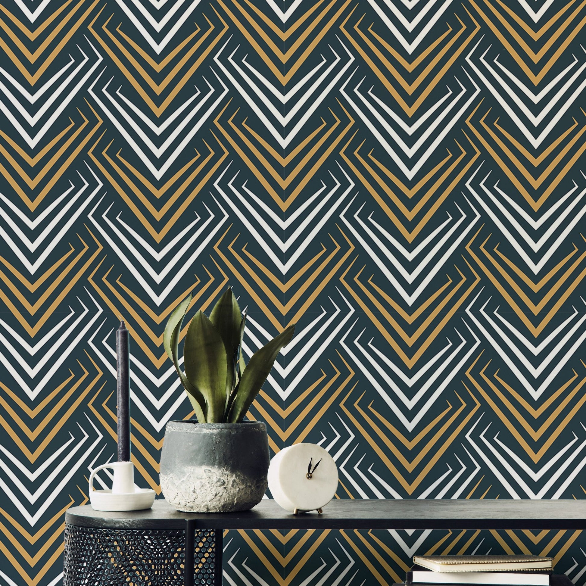 Yellow and White Vintage Abstract Art Deco Wallpaper behind a plant on a black table.